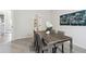 Dining room featuring modern table, chairs, carpet and decorative wall art at 306 Rodeo Dr, Auburn, GA 30102