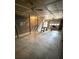 The unfinished basement has stairs, exposed ceilings and lighting at 905 Park Ne Pl, Conyers, GA 30012