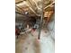 An unfinished basement with exposed pipes and block walls is spacious at 905 Park Ne Pl, Conyers, GA 30012