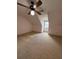 An upper floor bedroom features a ceiling fan, one window, and carpeted floors at 905 Park Ne Pl, Conyers, GA 30012