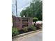 The Belmont Village Hunters Pointe community entrance sign is planted with greenery at 905 Park Ne Pl, Conyers, GA 30012