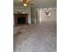 Spacious living room featuring a brick fireplace and ample natural light at 905 Park Ne Pl, Conyers, GA 30012
