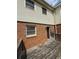 View of the back exterior brick siding with deck and a door at 905 Park Ne Pl, Conyers, GA 30012
