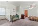 Bedroom featuring a ceiling fan, neutral carpet, a window, and light green vintage furniture at 110 The Farm Rd, Mcdonough, GA 30252