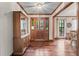 Welcoming foyer featuring hardwood floors, decorative ceiling, and a view into adjacent rooms at 110 The Farm Rd, Mcdonough, GA 30252