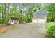 Exterior image of a home with a two car garage, a shed, and a driveway at 110 The Farm Rd, Mcdonough, GA 30252