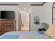 Hallway between bedroom and bathroom with wood floors, wooden doors, and recessed lights at 110 The Farm Rd, Mcdonough, GA 30252