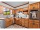 Well-organized kitchen featuring oak cabinets, tile backsplash, stainless steel appliances at 110 The Farm Rd, Mcdonough, GA 30252