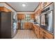 Functional kitchen with stainless steel appliances, tile backsplash, and ample cabinet space at 110 The Farm Rd, Mcdonough, GA 30252