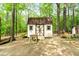 An outbuilding with a charming exterior provides extra storage space for tools, equipment, or recreational items at 110 The Farm Rd, Mcdonough, GA 30252