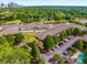 Aerial view of a complex with trees, a pool, and parking at 1195 Milton Ter # 1304, Atlanta, GA 30315
