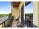 Cozy balcony with seating and views of the surrounding trees and neighborhood homes at 1195 Milton Ter # 1304, Atlanta, GA 30315