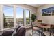 Bright breakfast nook boasts skyline views and access to the outdoor balcony at 1195 Milton Ter # 1304, Atlanta, GA 30315