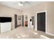 A spacious bedroom with multiple doors and a ceiling fan at 1195 Milton Ter # 1304, Atlanta, GA 30315