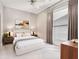 Bright bedroom featuring a large window, ceiling fan, and stylish decor at 1195 Milton Ter # 1304, Atlanta, GA 30315