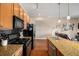 Modern kitchen with stainless steel appliances, granite counters, and hardwood floors at 1195 Milton Ter # 1304, Atlanta, GA 30315