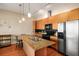 Well-equipped kitchen featuring stainless steel appliances, granite countertops, and a functional island at 1195 Milton Ter # 1304, Atlanta, GA 30315