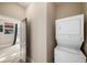A laundry room with a stacked washer and dryer unit at 1195 Milton Ter # 1304, Atlanta, GA 30315