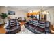 Inviting living room featuring hardwood floors, modern lighting, and an open floor plan connecting to the kitchen at 1195 Milton Ter # 1304, Atlanta, GA 30315