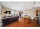 Open-concept living space with a modern kitchen, leather seating, and balcony access at 1195 Milton Ter # 1304, Atlanta, GA 30315