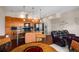 Open-concept living space with a gourmet kitchen, leather seating, and dining table at 1195 Milton Ter # 1304, Atlanta, GA 30315