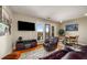 Bright living room with hardwood floors, a balcony view, and comfortable seating, perfect for relaxation at 1195 Milton Ter # 1304, Atlanta, GA 30315