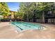 Outdoor swimming pool with an adjacent pool house, barbecue grill and lounge chairs at 1195 Milton Ter # 1304, Atlanta, GA 30315