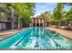 Outdoor swimming pool with an adjacent pool house and surrounding greenery at 1195 Milton Ter # 1304, Atlanta, GA 30315