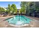 Outdoor swimming pool with an adjacent pool house, barbecue grill and lounge chairs at 1195 Milton Ter # 1304, Atlanta, GA 30315