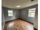Bedroom offers natural light from two windows and hard wood floors to add your own touch at 4009 Ester Sw Dr, Atlanta, GA 30331