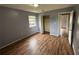 This bedroom features hard wood floors, closet, and a neutral color to add your own style at 4009 Ester Sw Dr, Atlanta, GA 30331