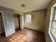 Bedroom offers natural light from one window and hard wood floors to add your own touch at 4009 Ester Sw Dr, Atlanta, GA 30331