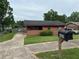 Charming single-story home featuring a brick facade, cozy porch, and well-maintained lawn at 4009 Ester Sw Dr, Atlanta, GA 30331