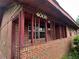 Close up view of a home's brick porch with decorative metalwork, and visible house number at 4009 Ester Sw Dr, Atlanta, GA 30331