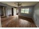 Spacious living room with hardwood floors, a ceiling fan, and ample natural light at 4009 Ester Sw Dr, Atlanta, GA 30331