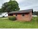 Cozy single-story home with a brick facade and small yard at 4009 Ester Sw Dr, Atlanta, GA 30331