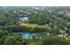 Aerial view featuring community tennis courts, baseball field, and gymnasium, surrounded by lush greenery at 59 Stafford Nw St, Atlanta, GA 30314