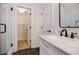 Bathroom featuring black hardware, tile floor, and shower with glass door at 59 Stafford Nw St, Atlanta, GA 30314