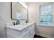 Bathroom with double sink vanity, marble countertop and black hardware at 59 Stafford Nw St, Atlanta, GA 30314