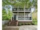 Charming two-story home featuring double balconies and brick-based front porch at 59 Stafford Nw St, Atlanta, GA 30314
