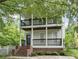 Charming two-story home featuring double balconies and brick-based front porch at 59 Stafford Nw St, Atlanta, GA 30314