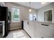 Kitchen features a breakfast bar, stainless appliances, and updated cabinetry at 59 Stafford Nw St, Atlanta, GA 30314