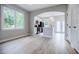 Kitchen and dining area with modern lighting, black appliances, and ample sunlight at 59 Stafford Nw St, Atlanta, GA 30314