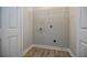 Laundry room features shelving and access for a washer and dryer at 59 Stafford Nw St, Atlanta, GA 30314