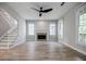 This light-filled living room has a fireplace, and adjacent stairway at 59 Stafford Nw St, Atlanta, GA 30314