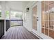 Charming front porch with wood floors and decorative black railing at 59 Stafford Nw St, Atlanta, GA 30314
