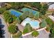 Aerial shot highlighting community amenities including tennis and a unique pool at 6084 Queens River Dr, Mableton, GA 30126