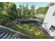 Well-maintained backyard with a terraced landscape, grassy area, and fencing at 6084 Queens River Dr, Mableton, GA 30126