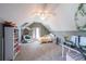 Vaulted ceiling bedroom featuring playful decor, a hammock chair, and natural light at 6084 Queens River Dr, Mableton, GA 30126