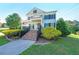Beautiful home exterior featuring an inviting entrance, manicured lawn, and lovely landscaping at 6084 Queens River Dr, Mableton, GA 30126